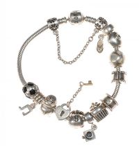 PANDORA STERLING SILVER BRACELET WITH TWELVE CHARMS at Ross's Online Art Auctions